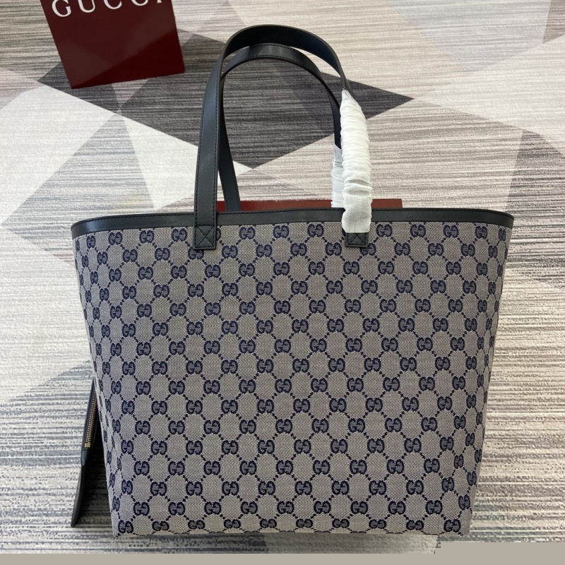 G*u*i shopping bags
